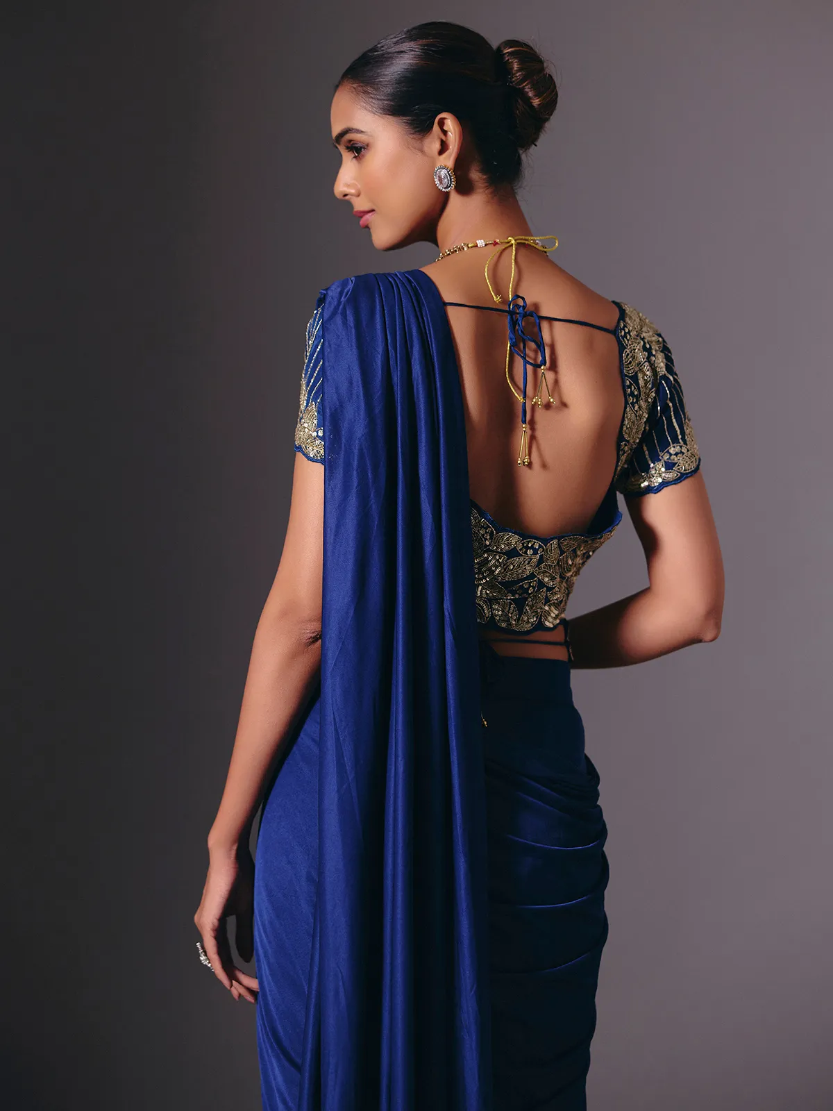Blue satin lycra saree with sparkling festive embellishments