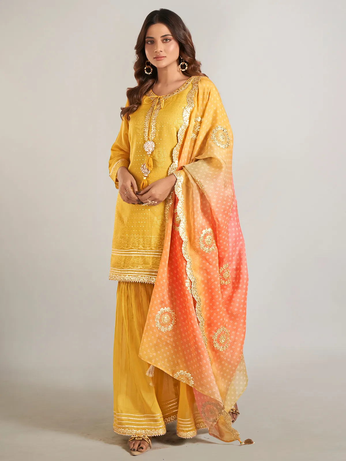 Mustard yellow silk sharara suit with dupatta