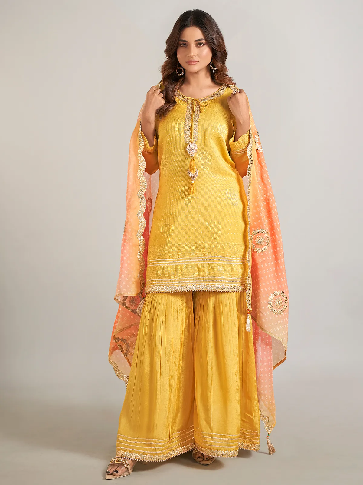 Mustard yellow silk sharara suit with dupatta