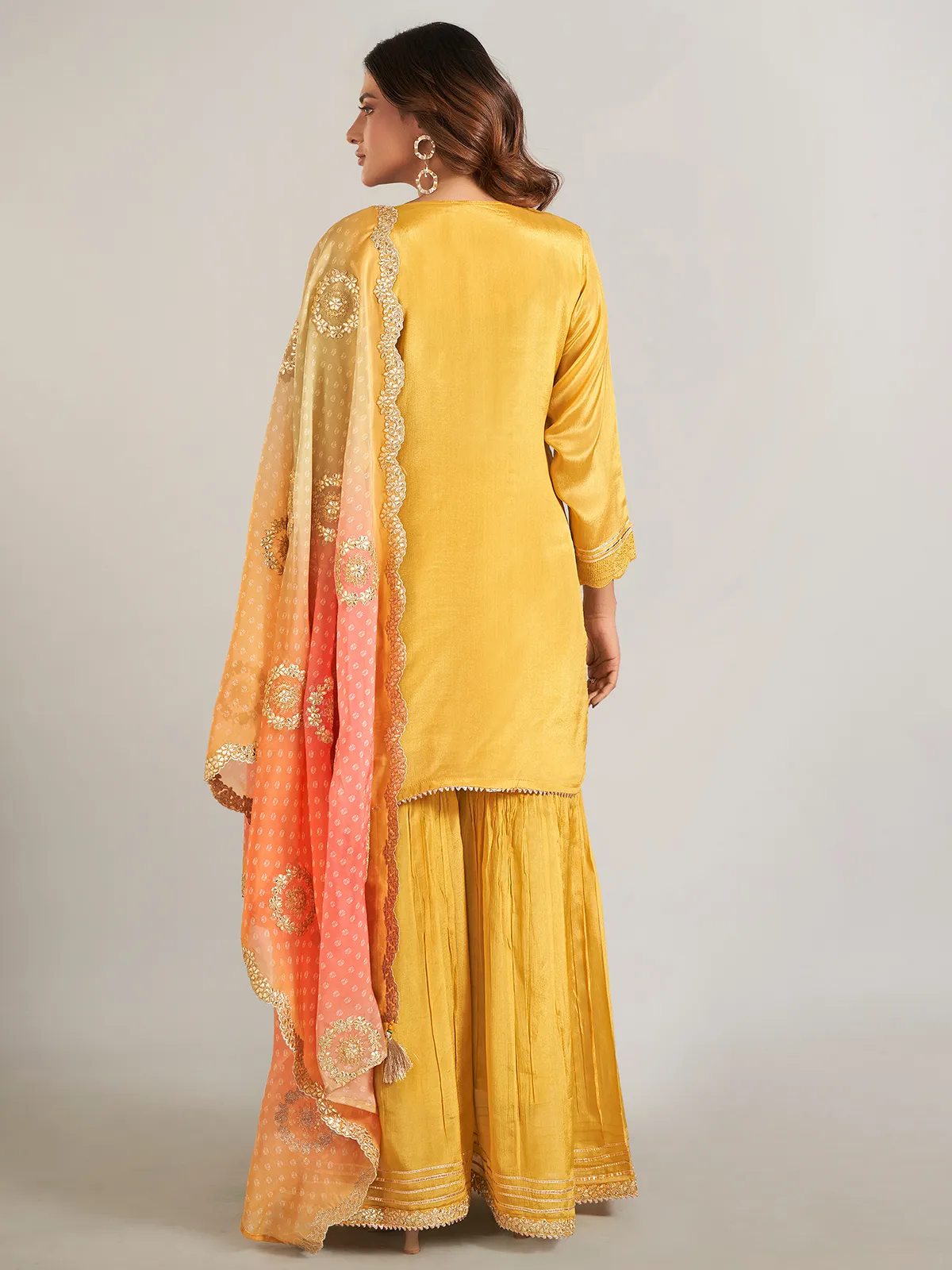 Mustard yellow silk sharara suit with dupatta