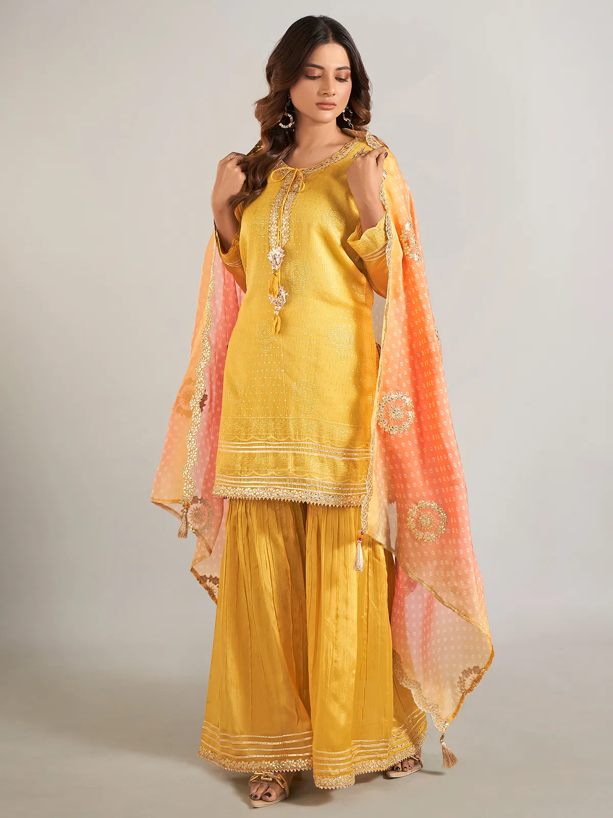 Mustard yellow silk sharara suit with dupatta