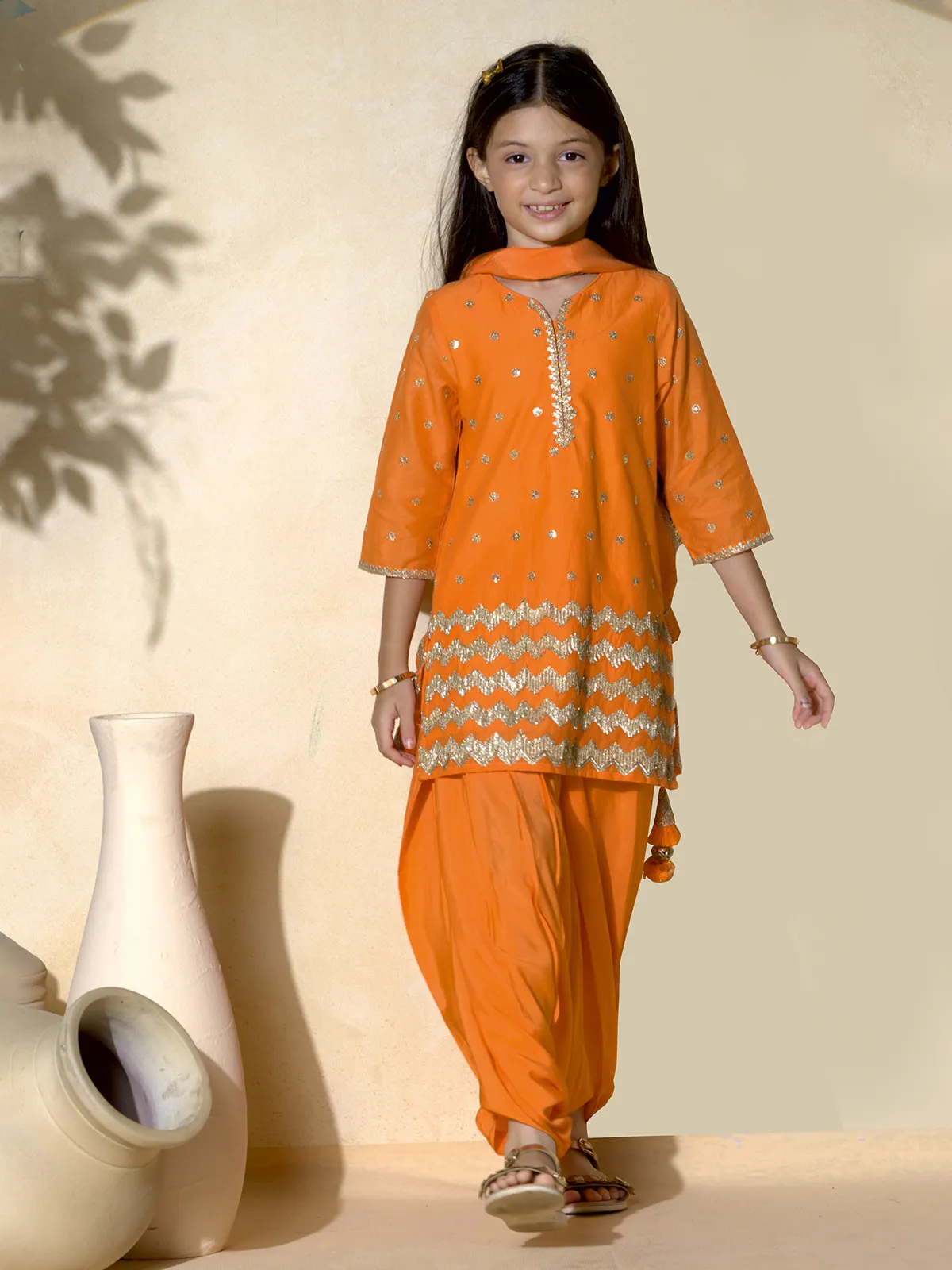 Orange punjabi girls salwar suit with resham and sequins