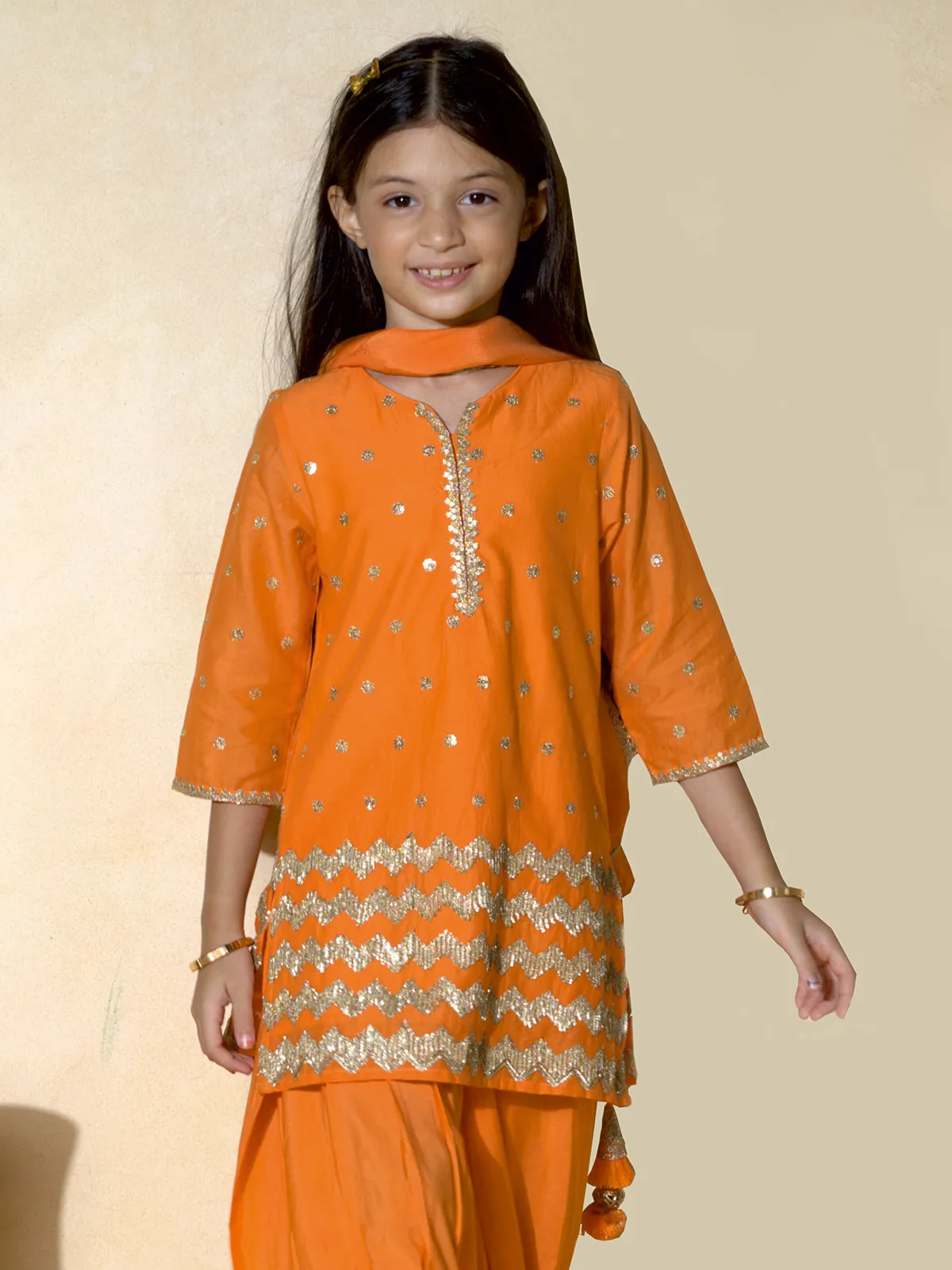 Orange punjabi girls salwar suit with resham and sequins
