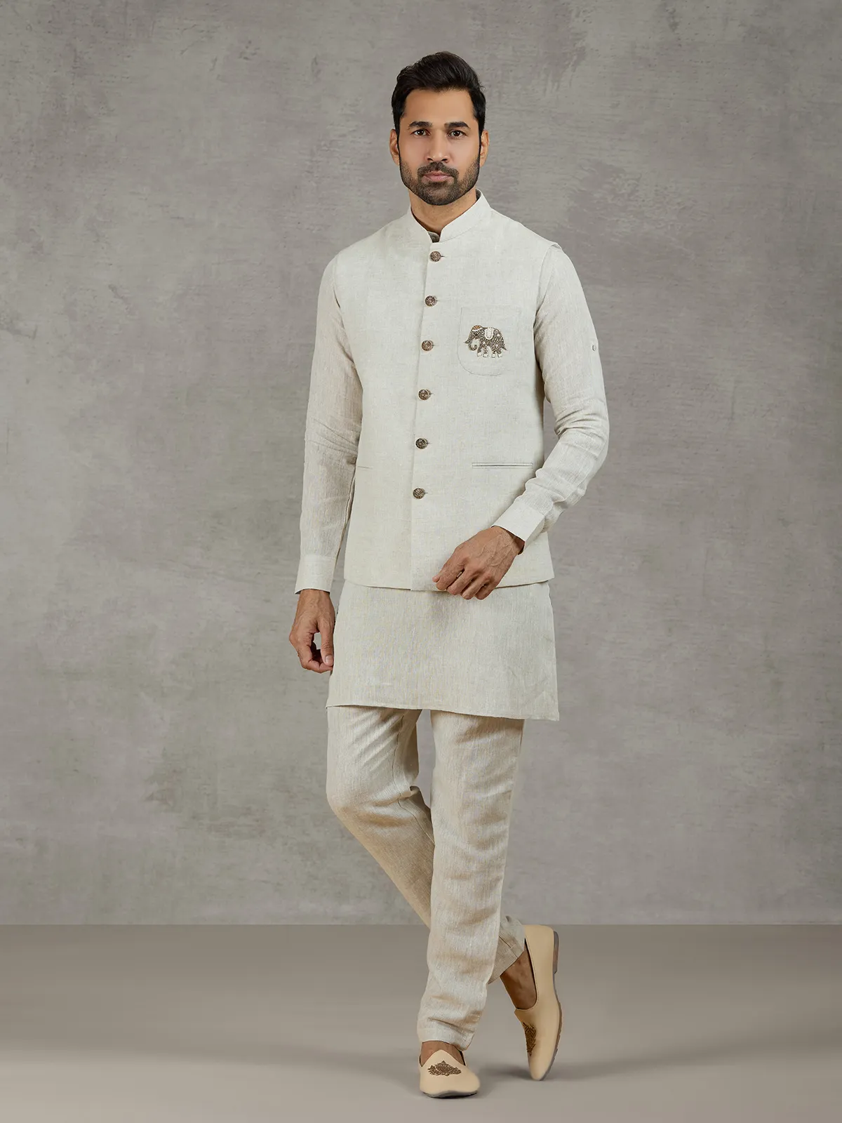 Beige linen waistcoat set with zari elephant embroidery