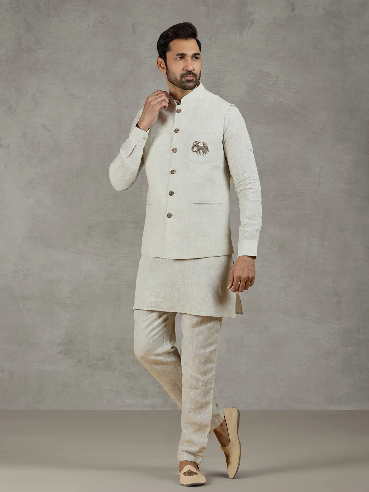 Beige linen waistcoat set with zari elephant embroidery