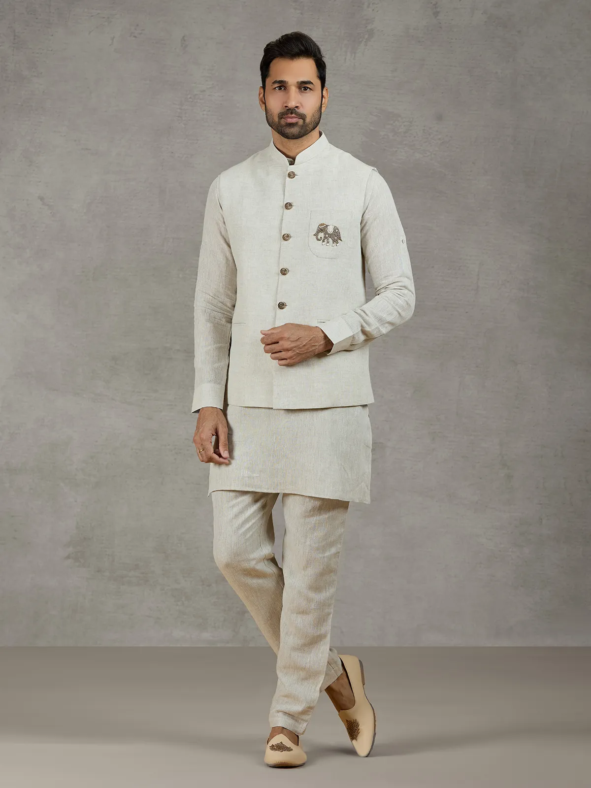 Beige linen waistcoat set with zari elephant embroidery