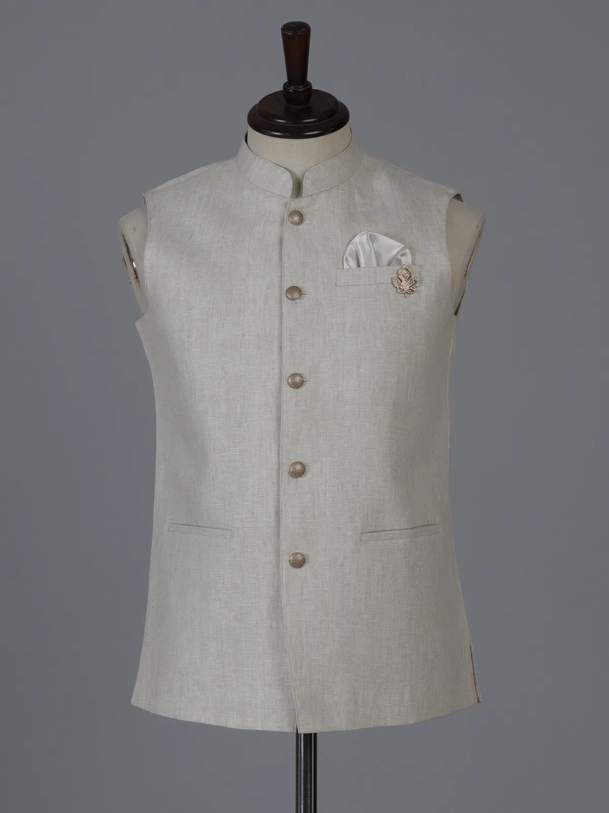 Beige linen waistcoat with brooch detailing