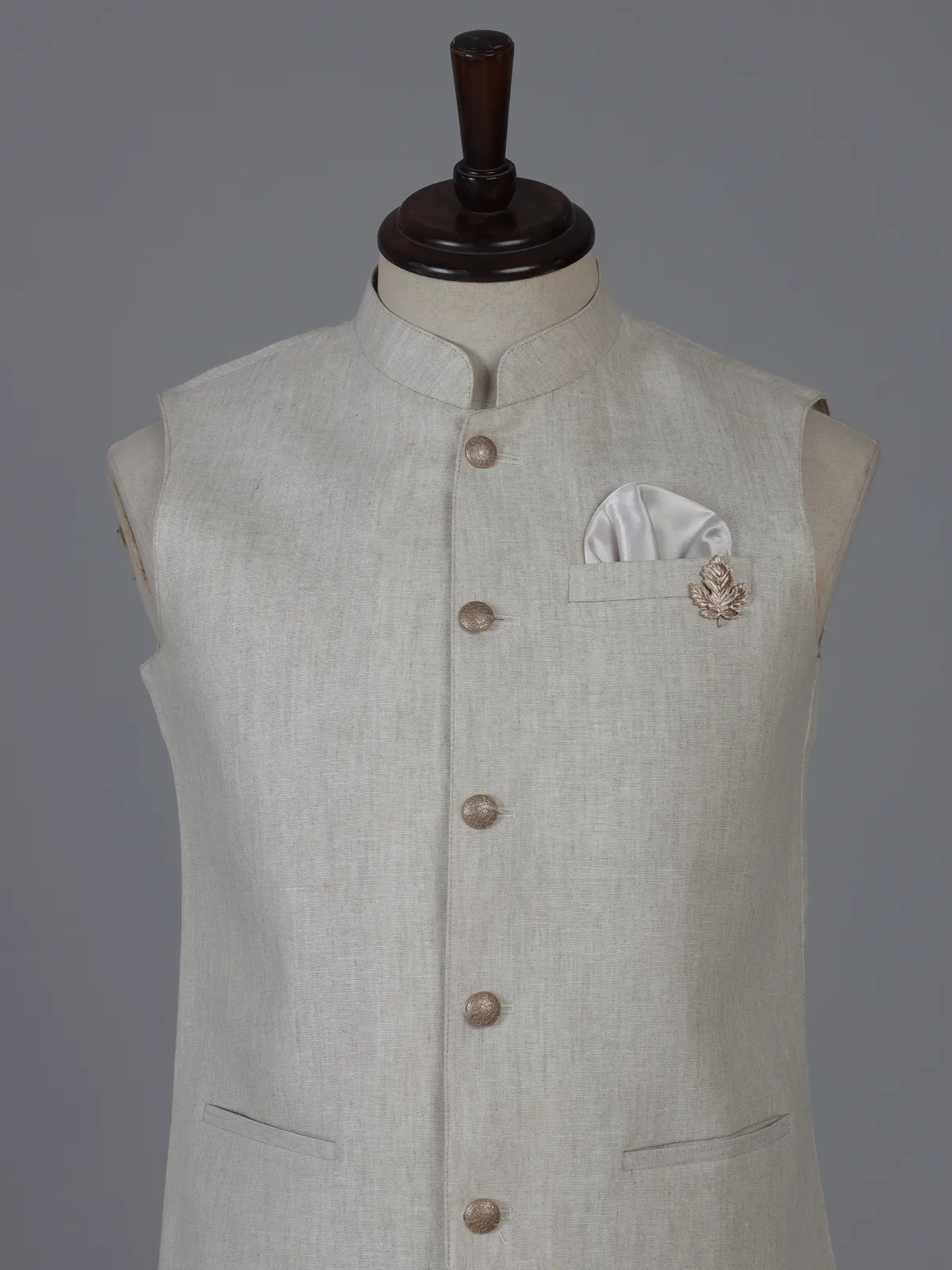Beige linen waistcoat with brooch detailing