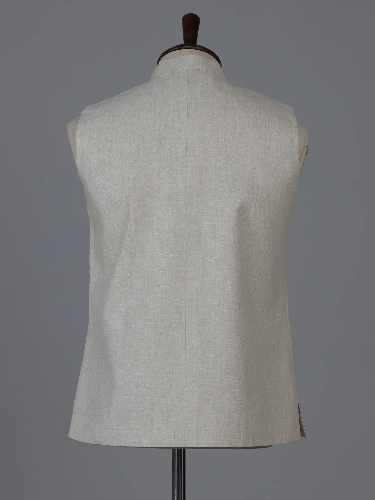 Beige linen waistcoat with brooch detailing