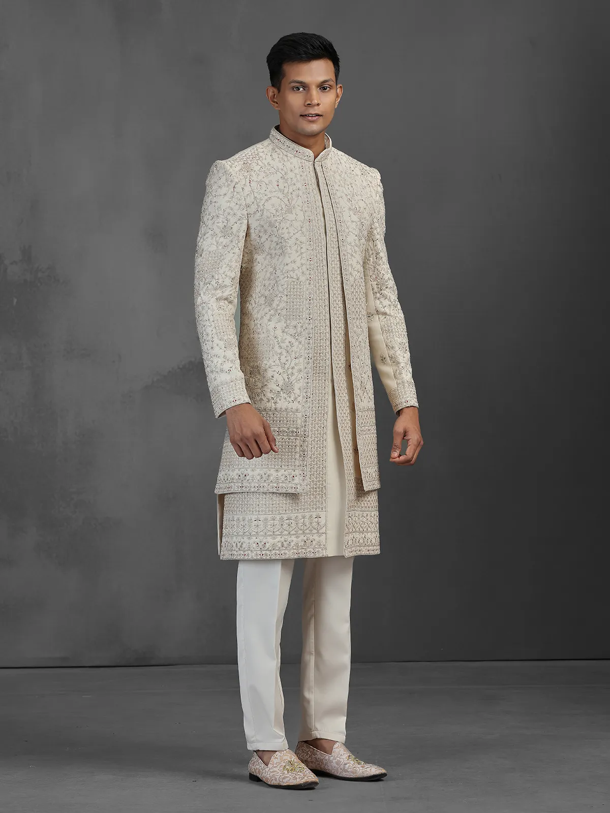 Beige silk groom sherwani with intricate embroidery