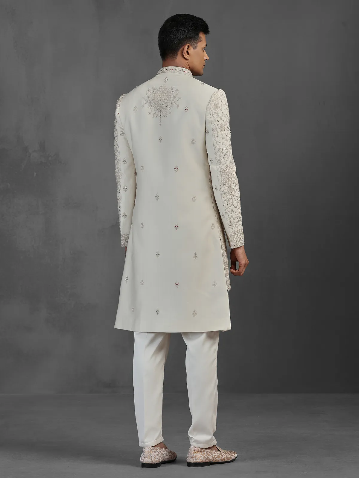 Beige silk groom sherwani with intricate embroidery