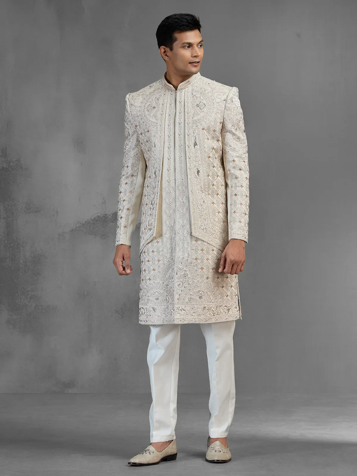 Beige silk open front sherwani with rich embroidery