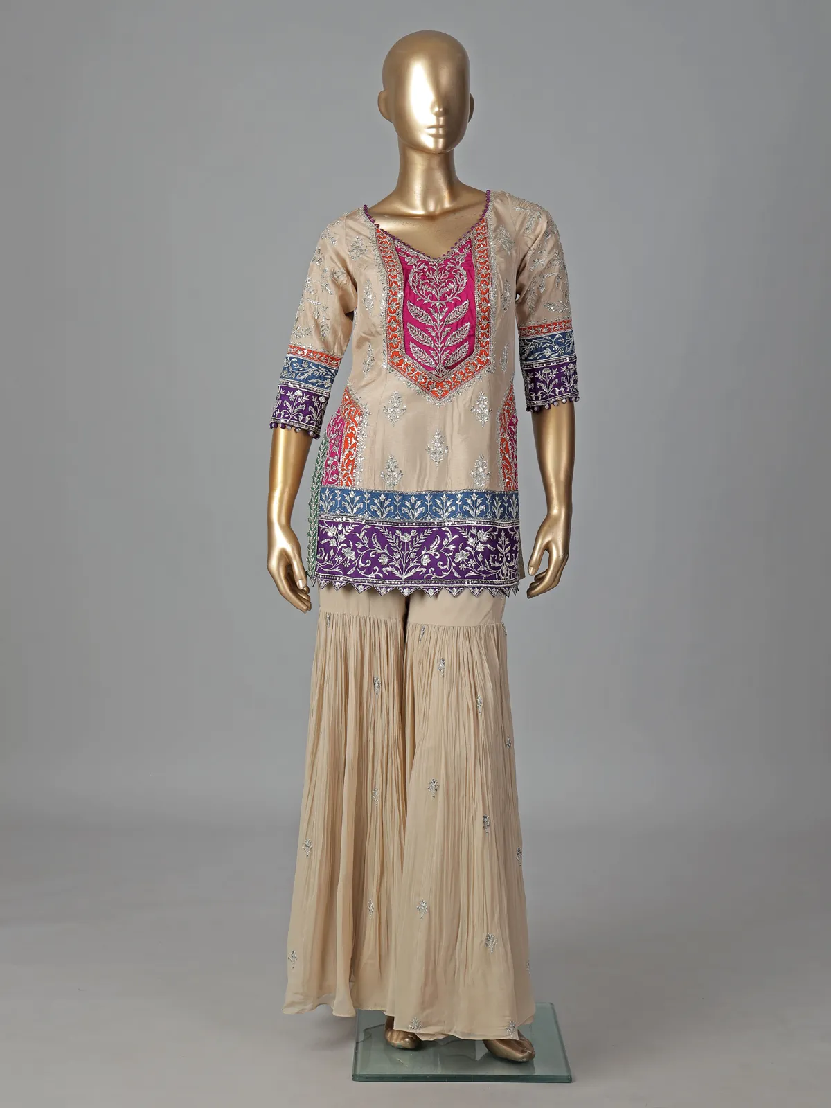 Beige silk sharara suit with elegant yoke design