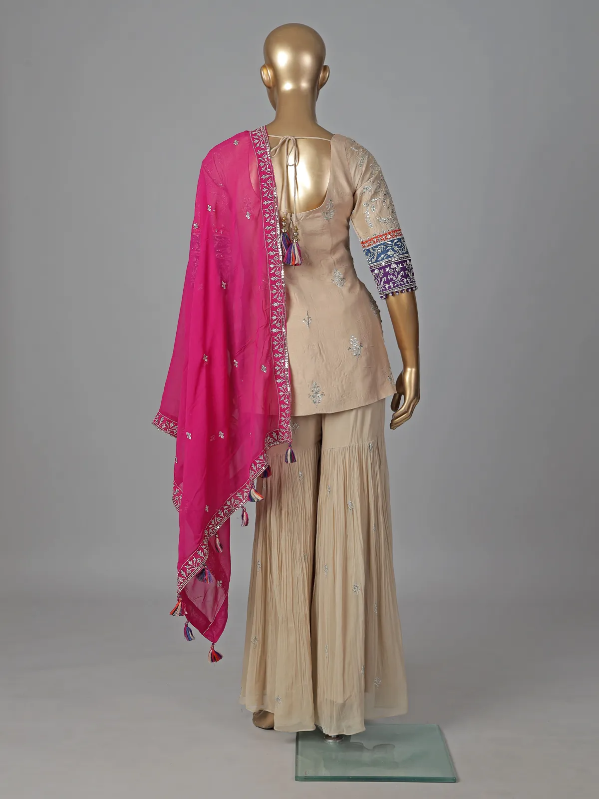 Beige silk sharara suit with elegant yoke design