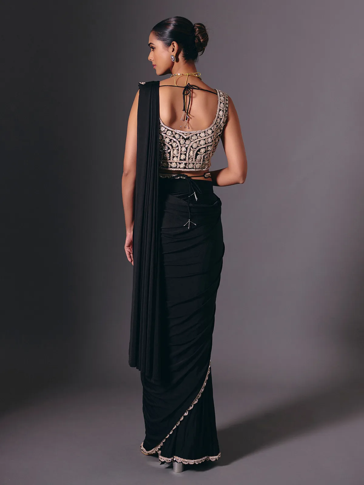 Black lycra saree with sequins and cutdana embellishments
