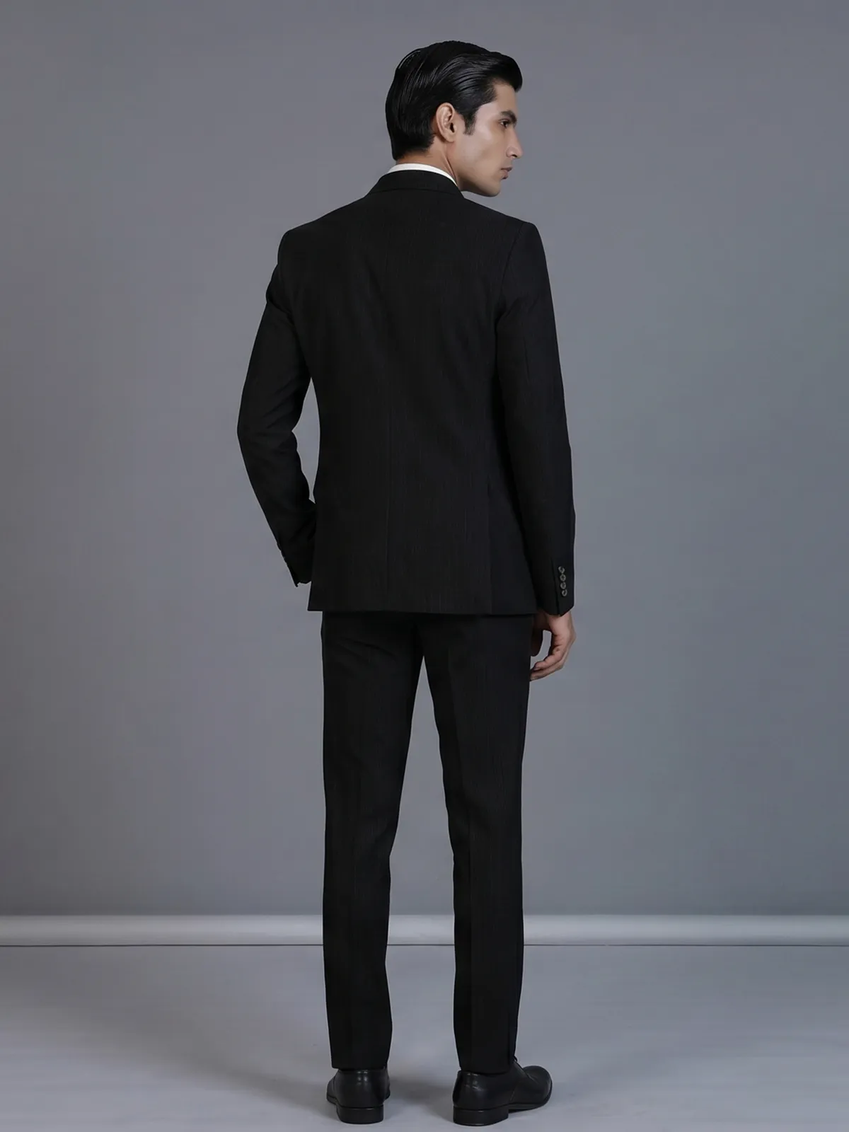 Black pinstripe formal double breasted suit with wide peak lapel