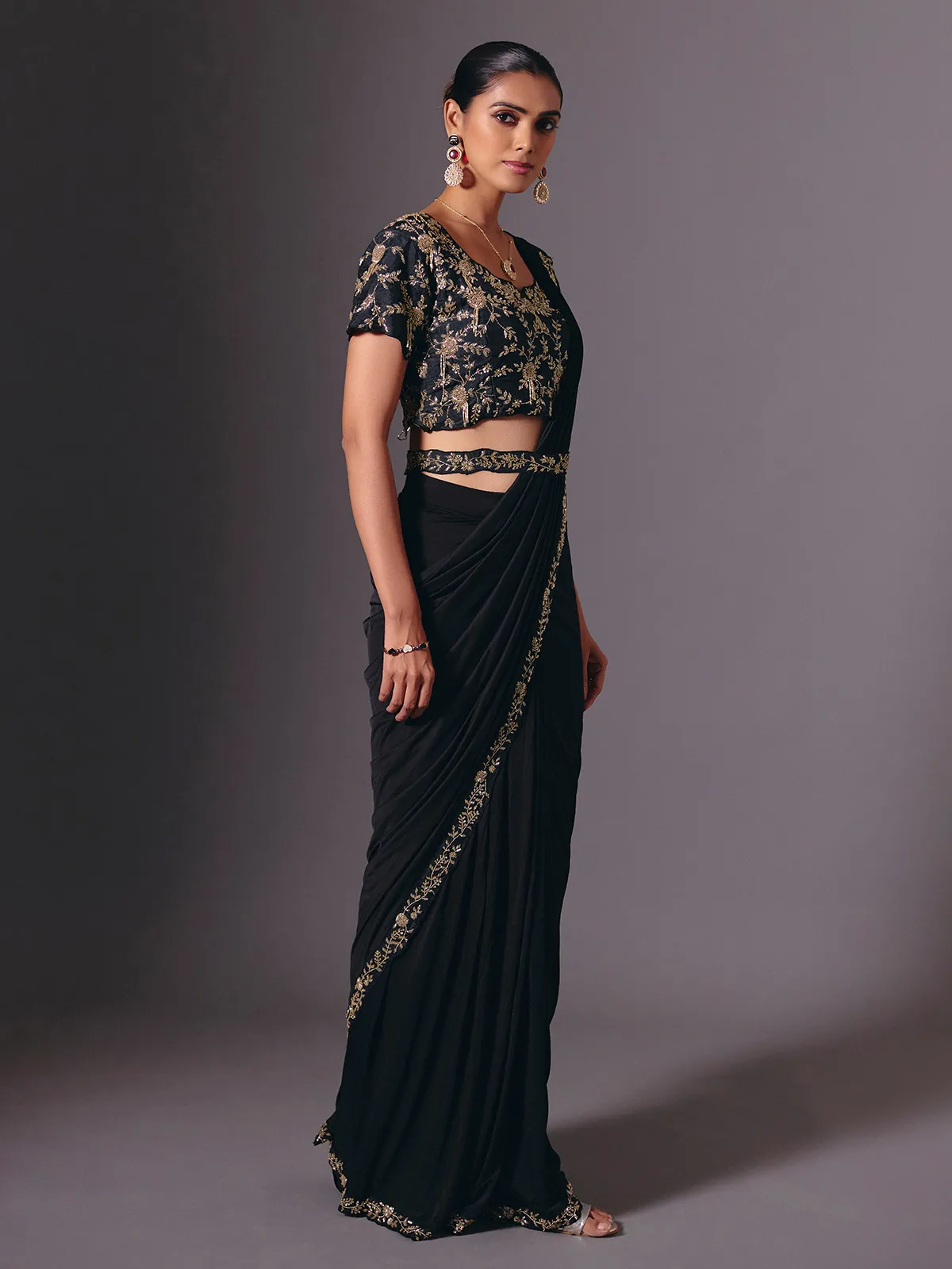 Black satin lycra saree with elegant festive embellishments