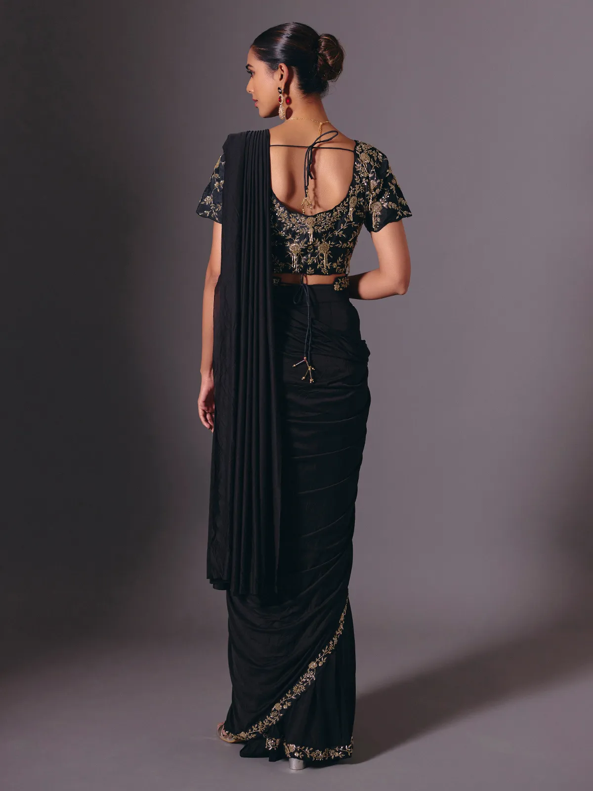 Black satin lycra saree with elegant festive embellishments