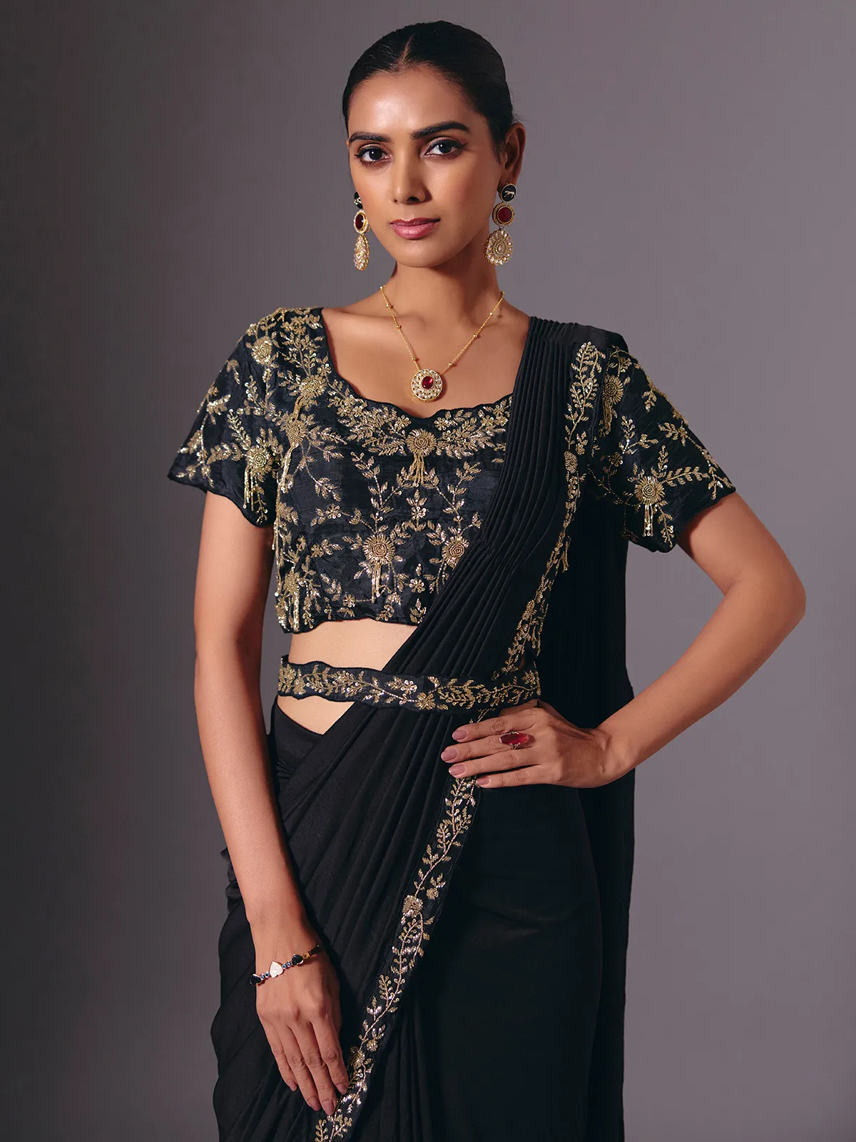 Black satin lycra saree with elegant festive embellishments