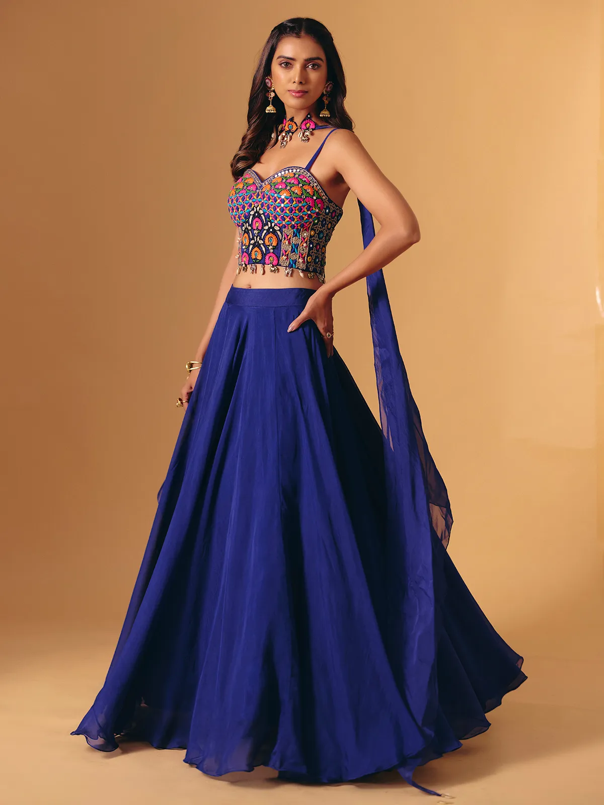 Blue georgette lehenga choli with cowrie shell