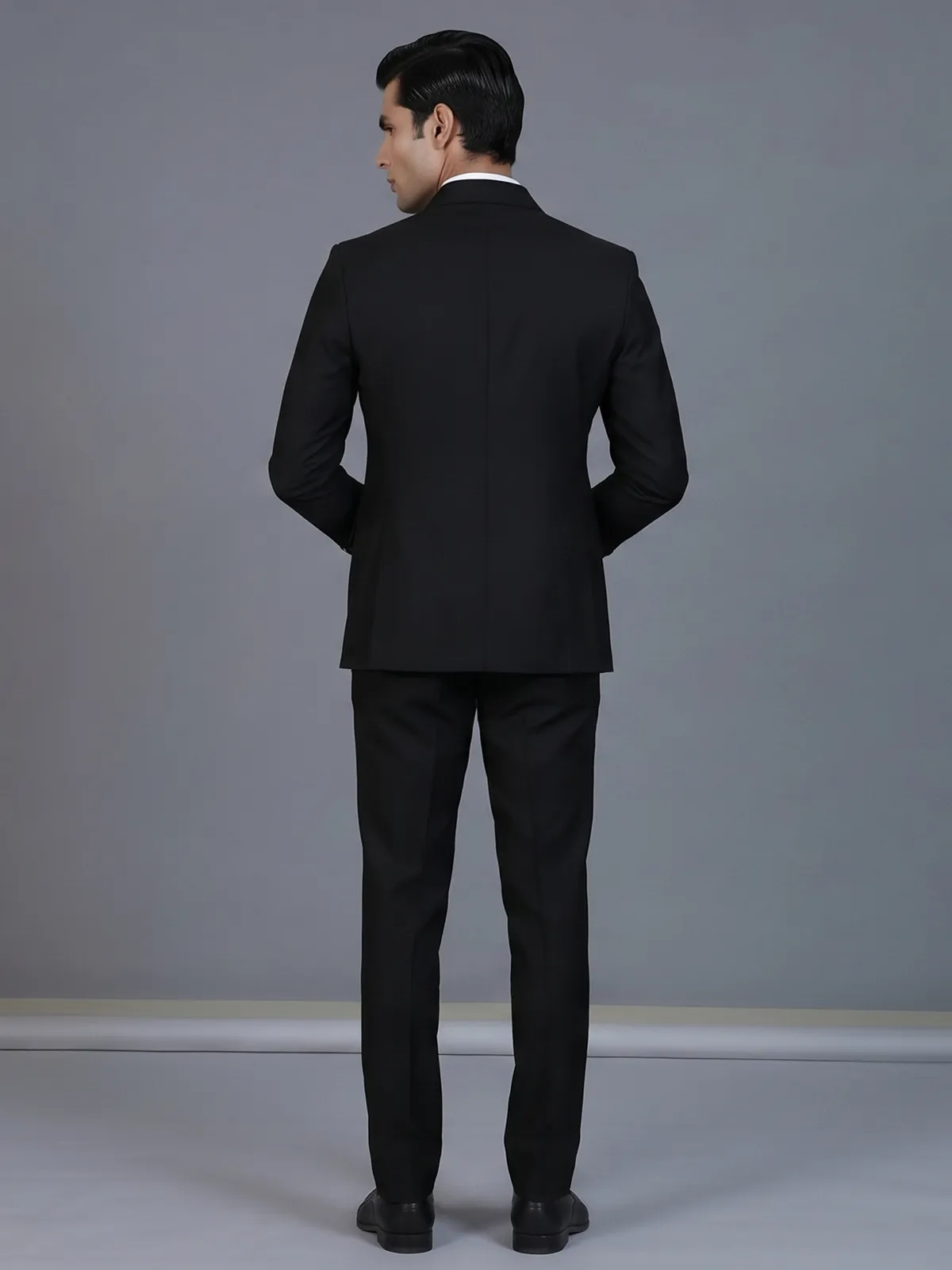 Classic black formal double breasted suit with bold peak lapel