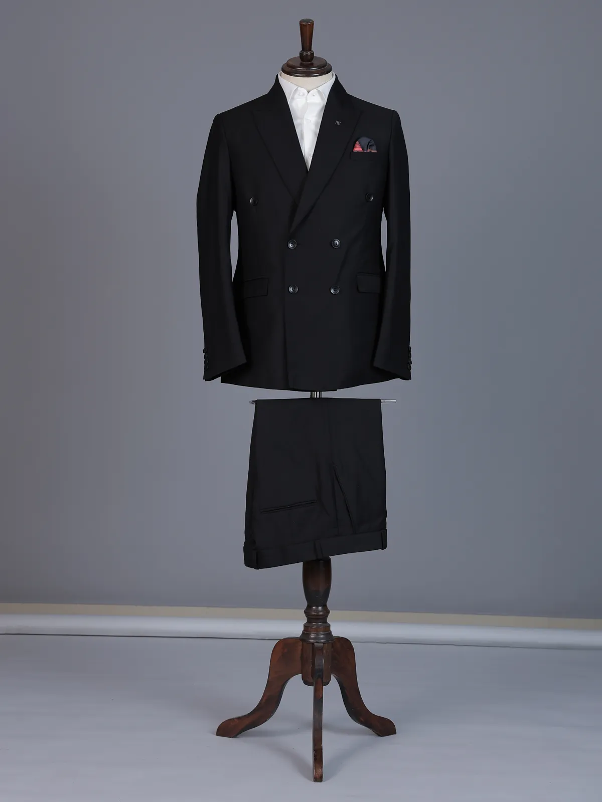 Classic black formal double breasted suit with bold peak lapel