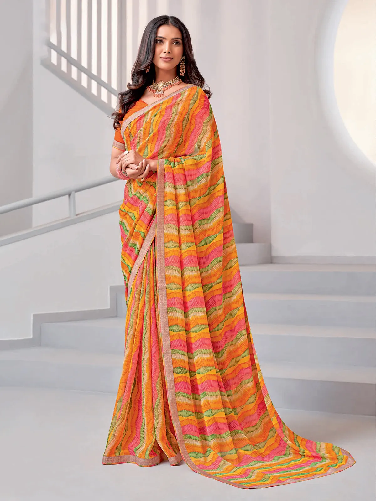 Classic orange printed georgette saree