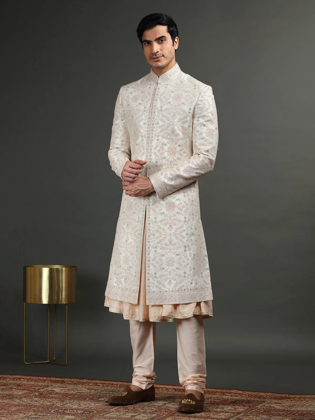 Cream and peach groom sherwani in raw silk