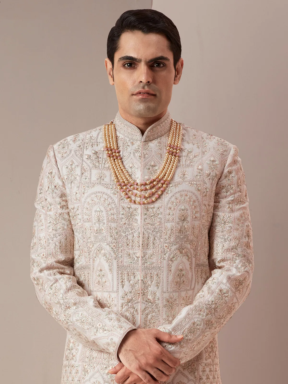 Cream and peach raw silk groom and wedding sherwani