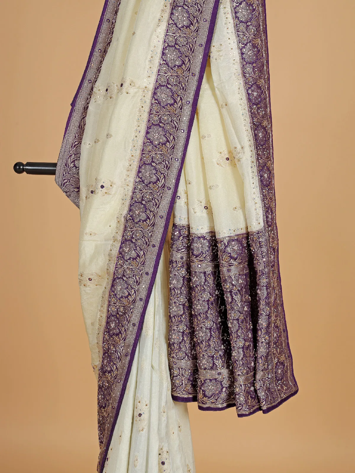 Cream and purple dola silk saree with zari work