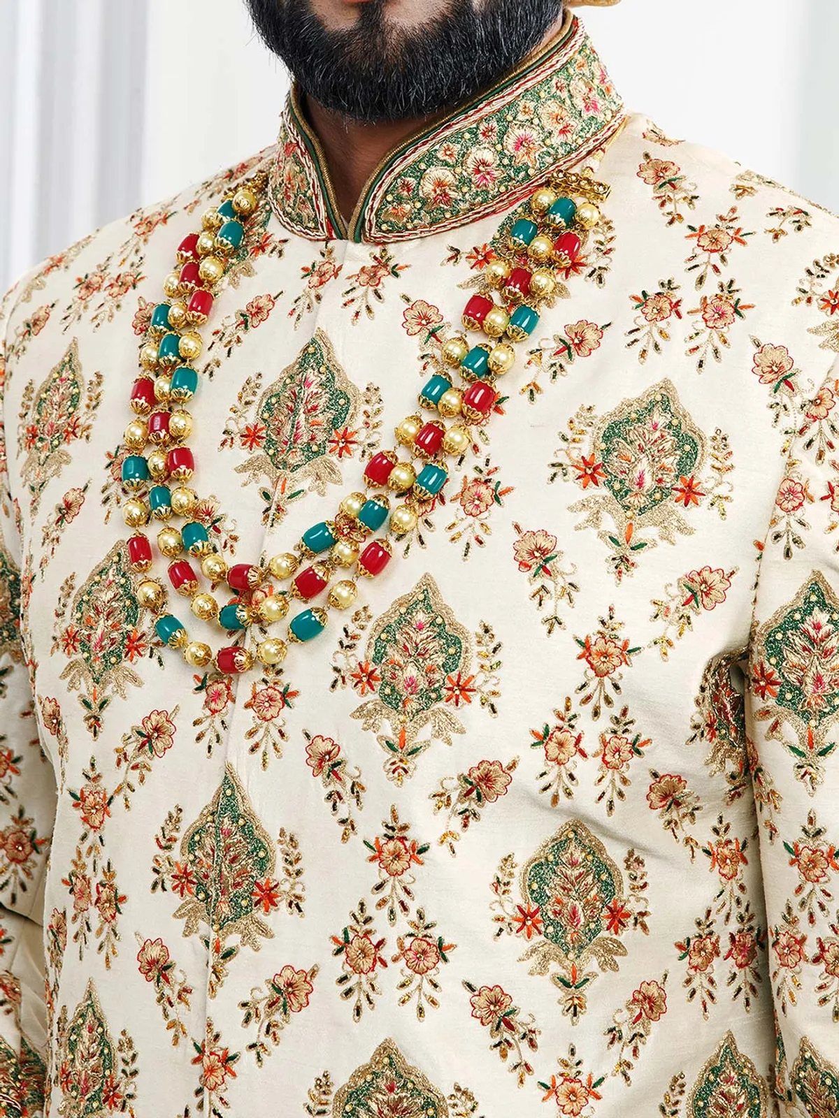 Cream colored designer groom wear sherwani
