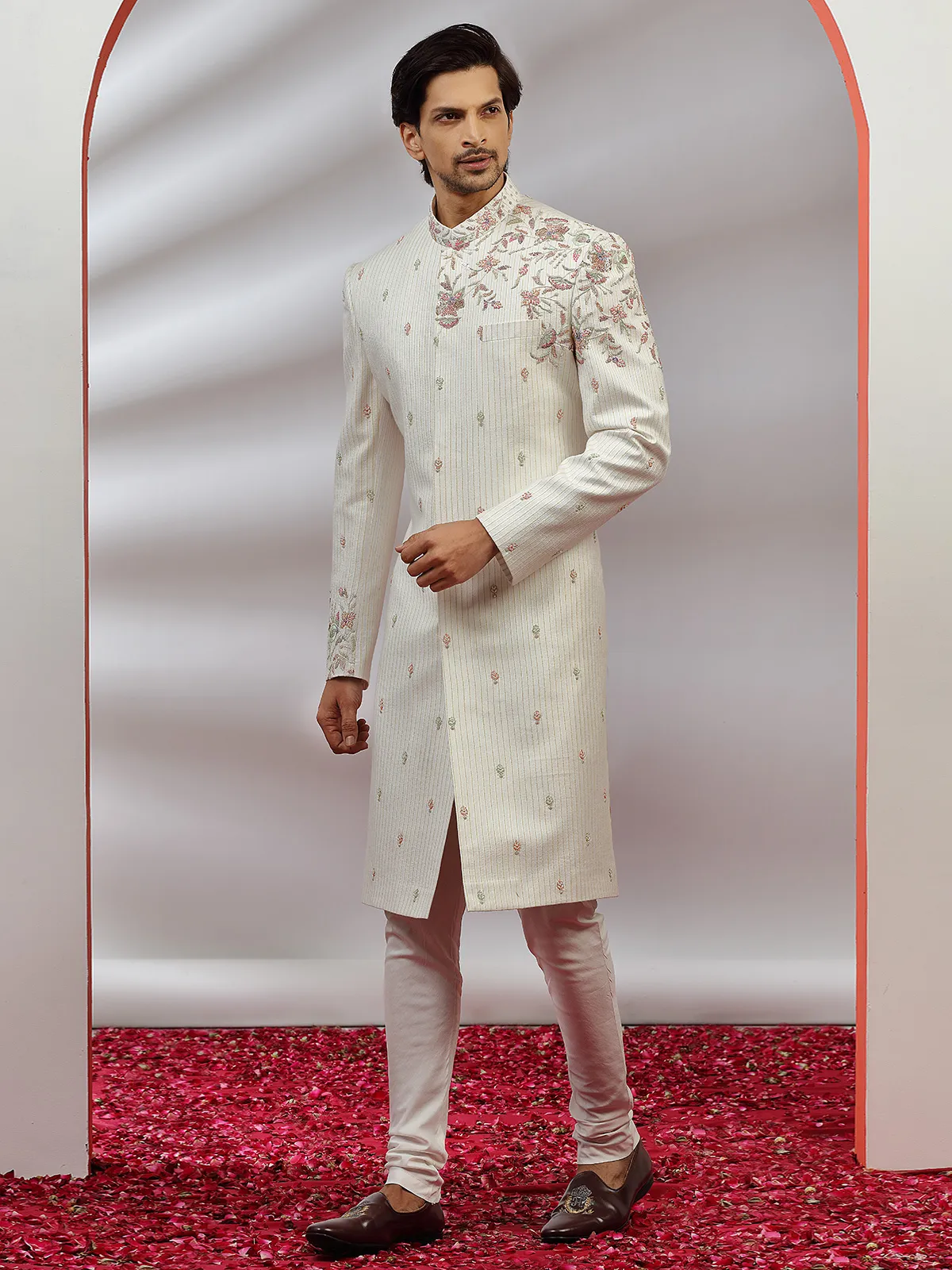 Cream hue raw silk groom wear sherwani