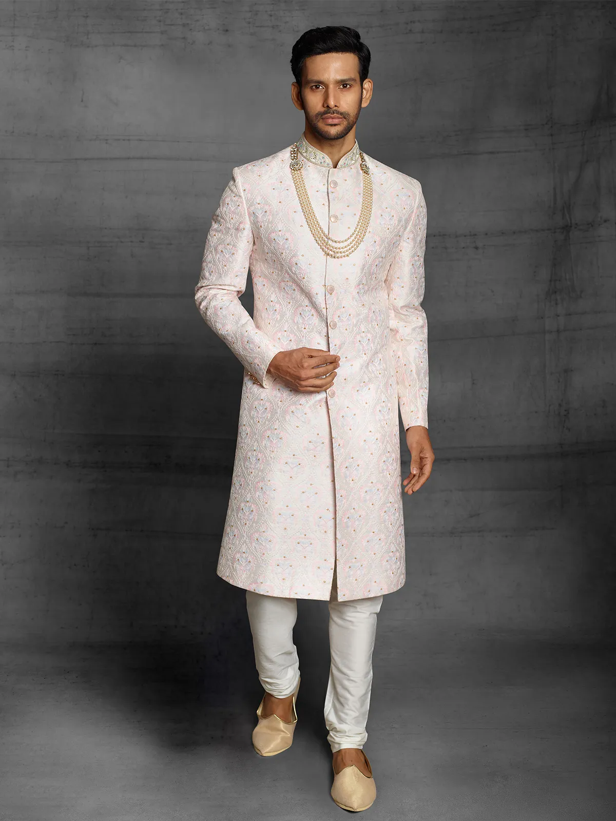 Cream hue raw silk sherwani for wedding event