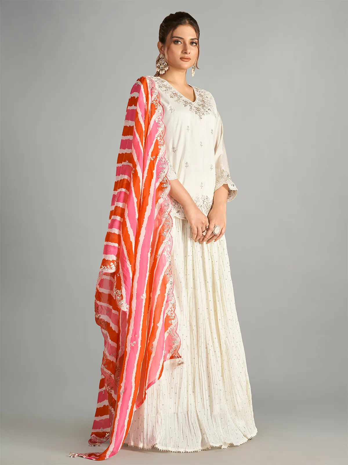 Cream lehenga suit with leheriya dupatta