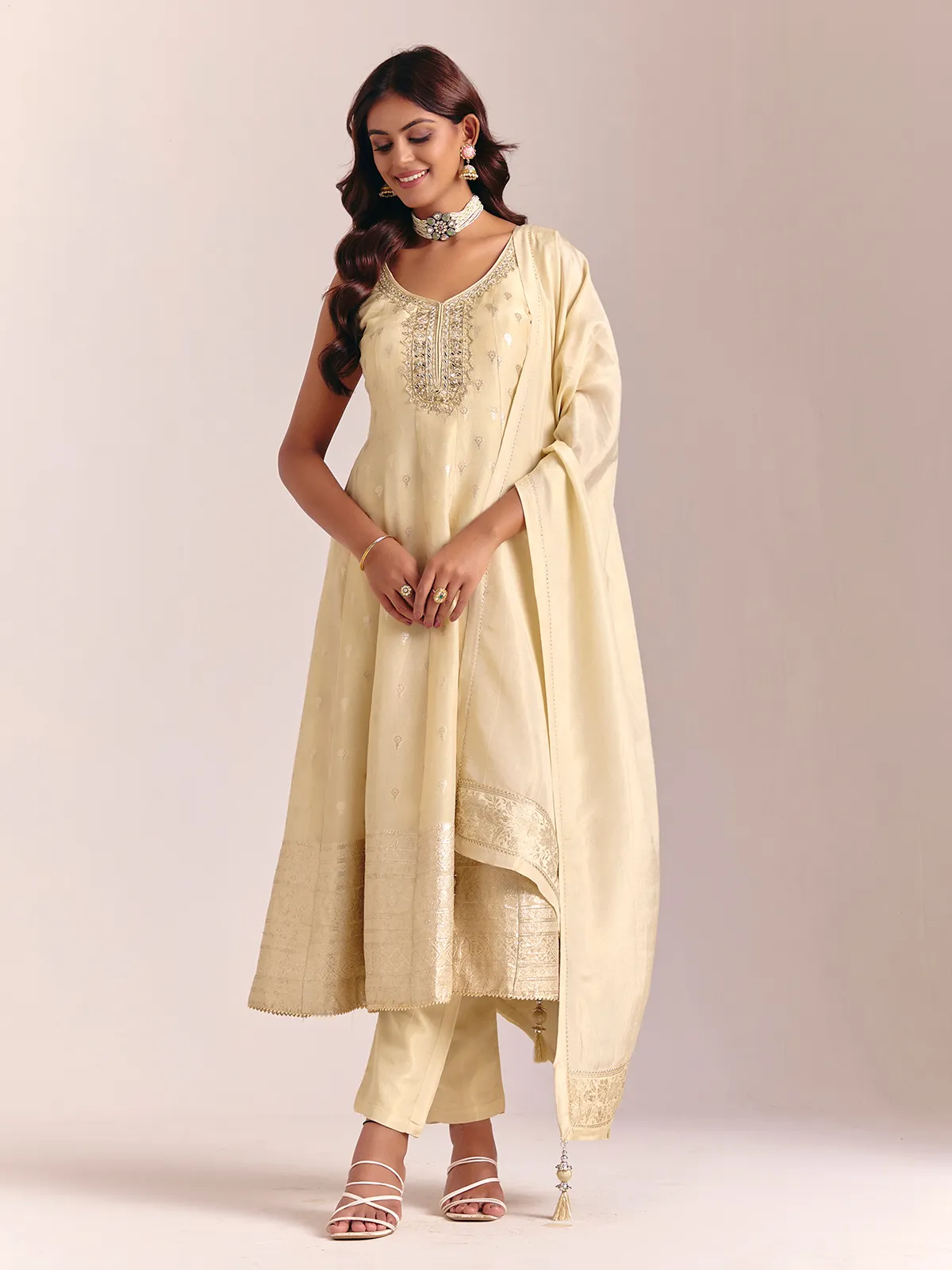 Cream silk sleeveless salwarsuit with dupatta