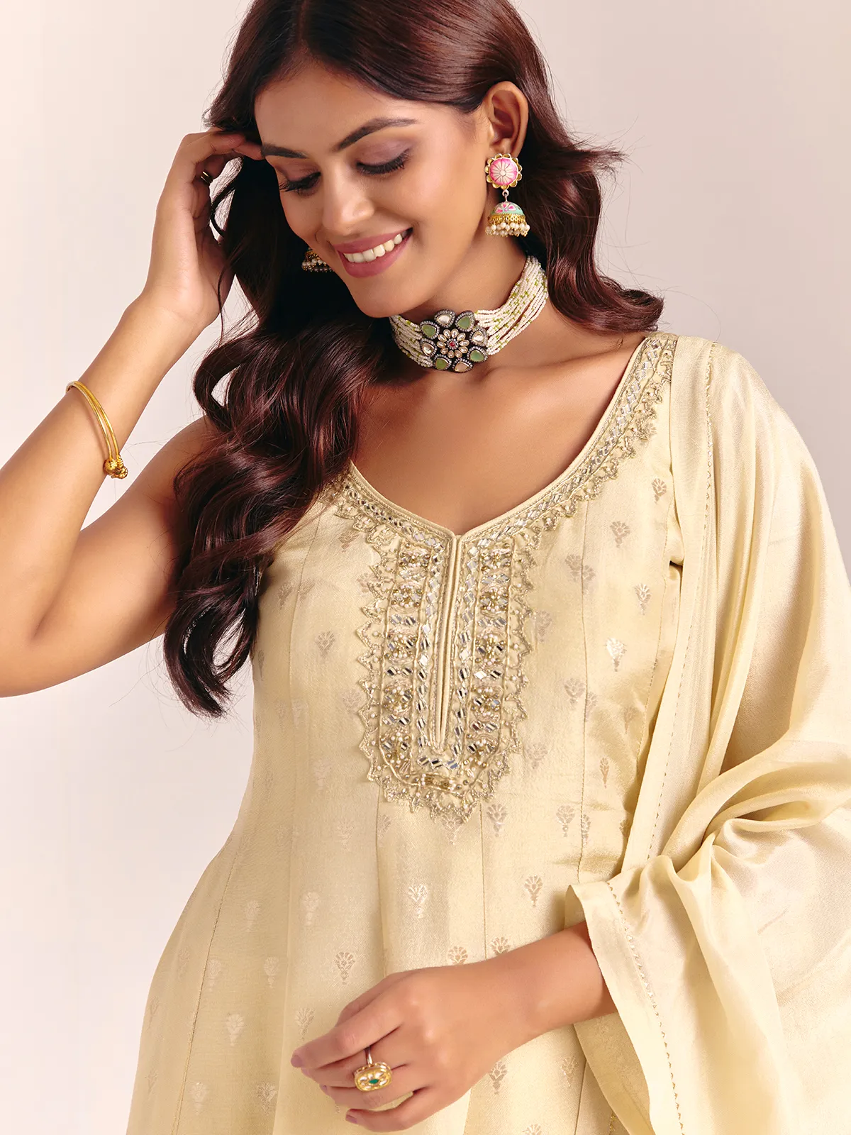 Cream silk sleeveless salwarsuit with dupatta