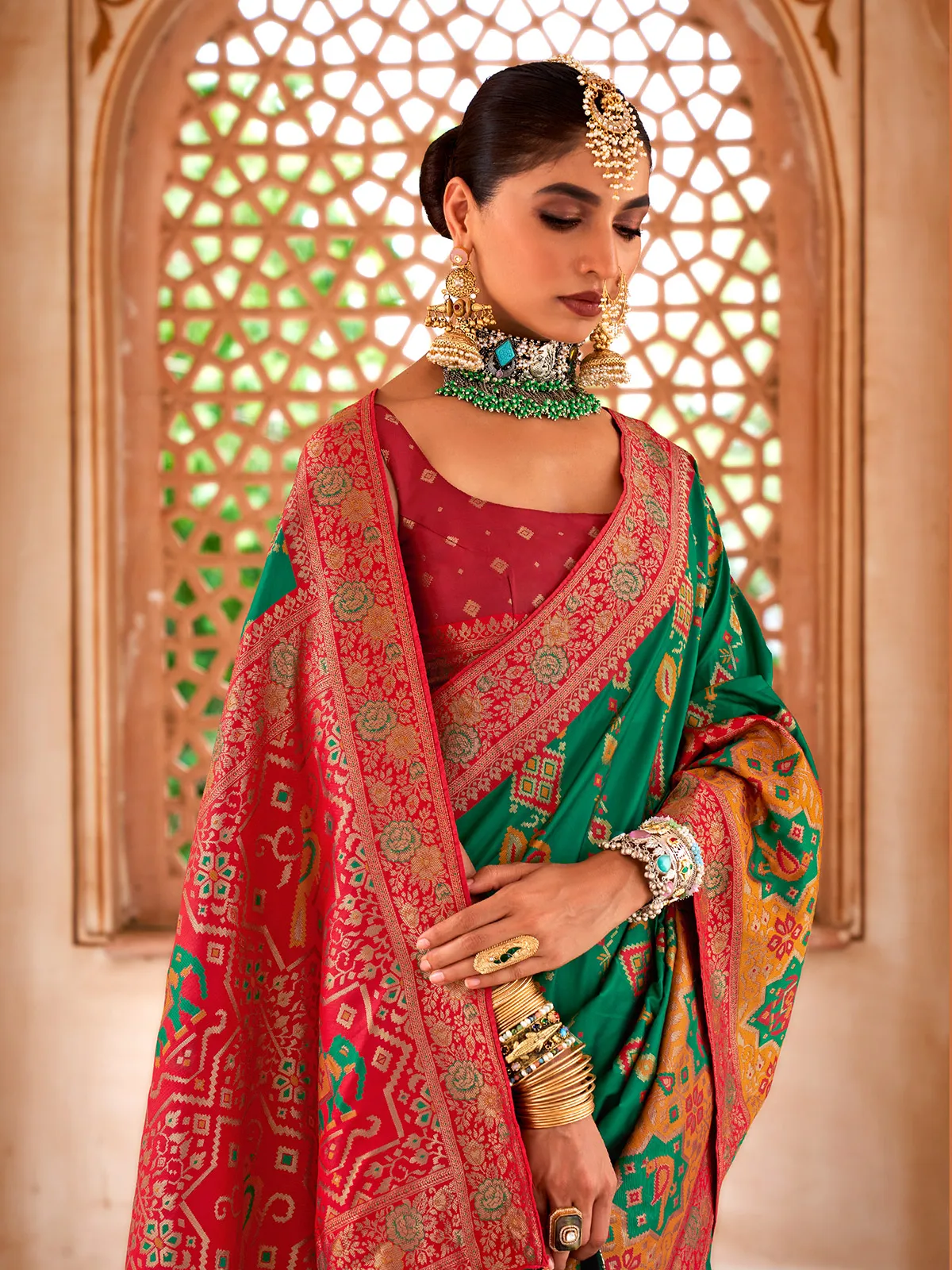 Dark green designer patola silk saree