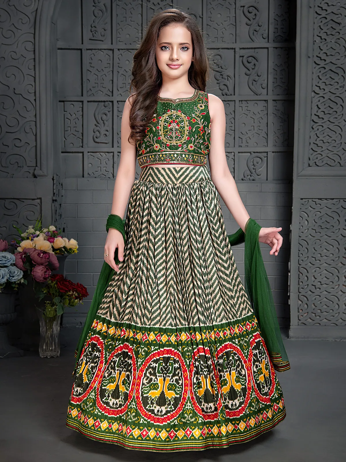 Dark green silk patola printed lehenga choli