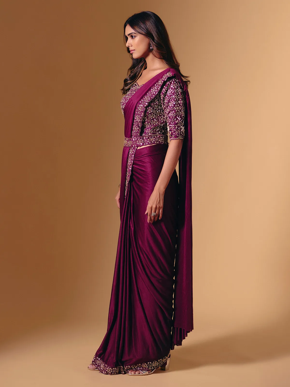 Dark purple lycra saree with shimmering cutdana design