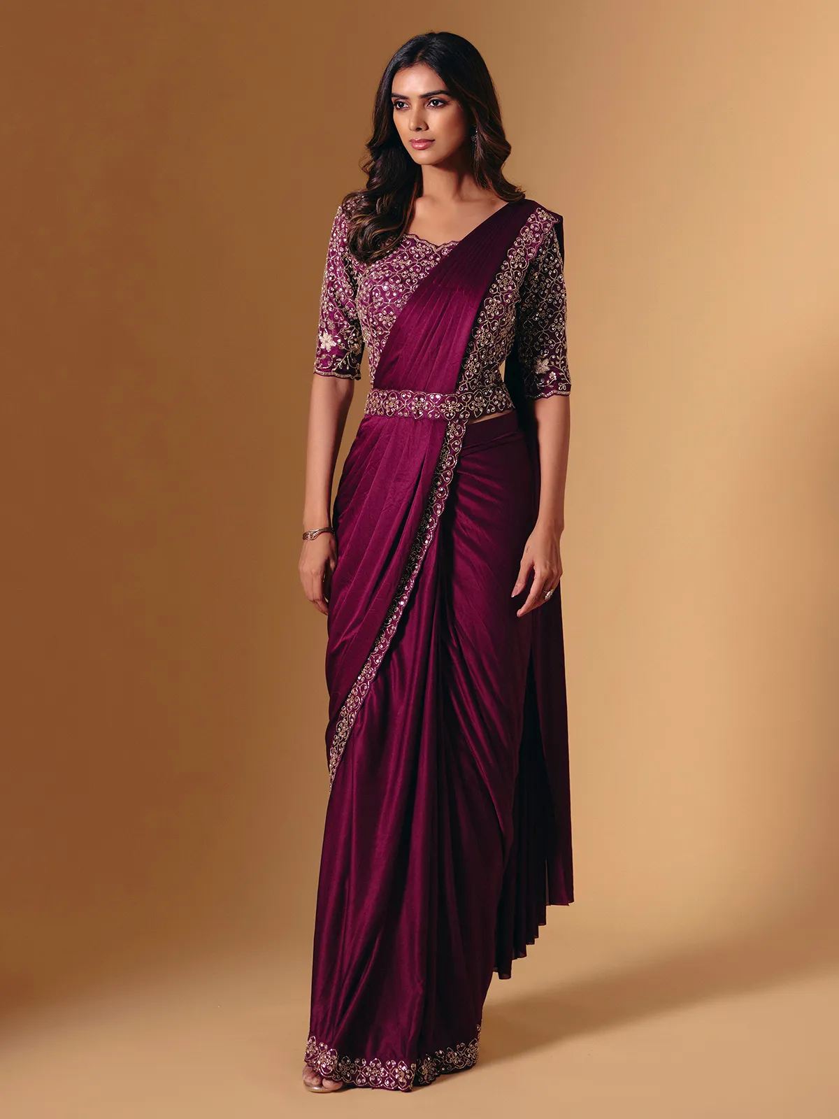 Dark purple lycra saree with shimmering cutdana design