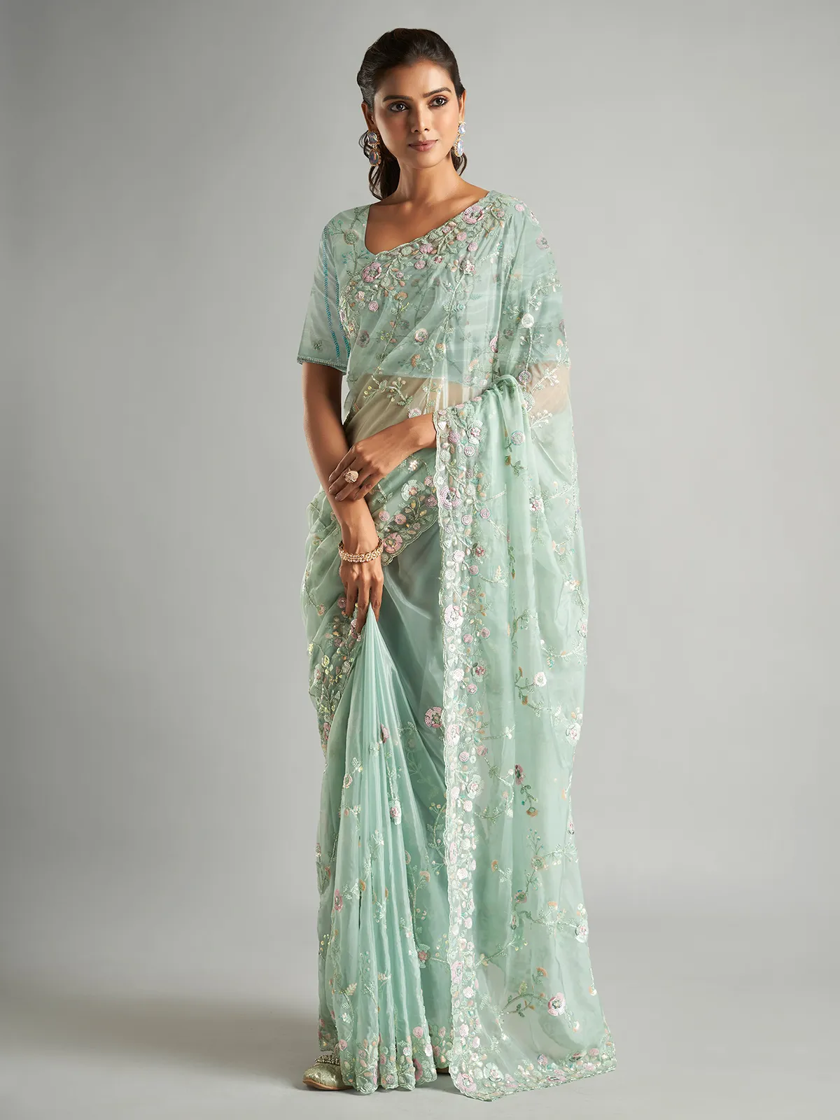 Elegant mint green organza saree