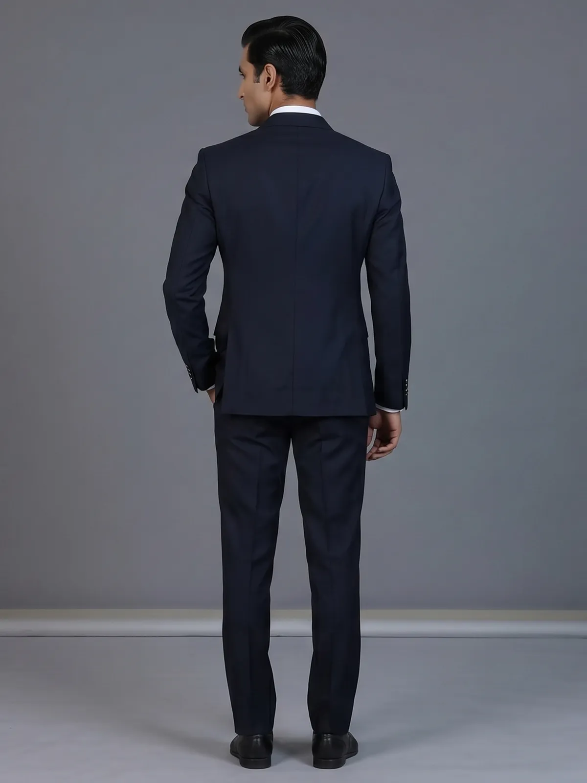 Elegant navy blue formal double breasted suit with peak lapel