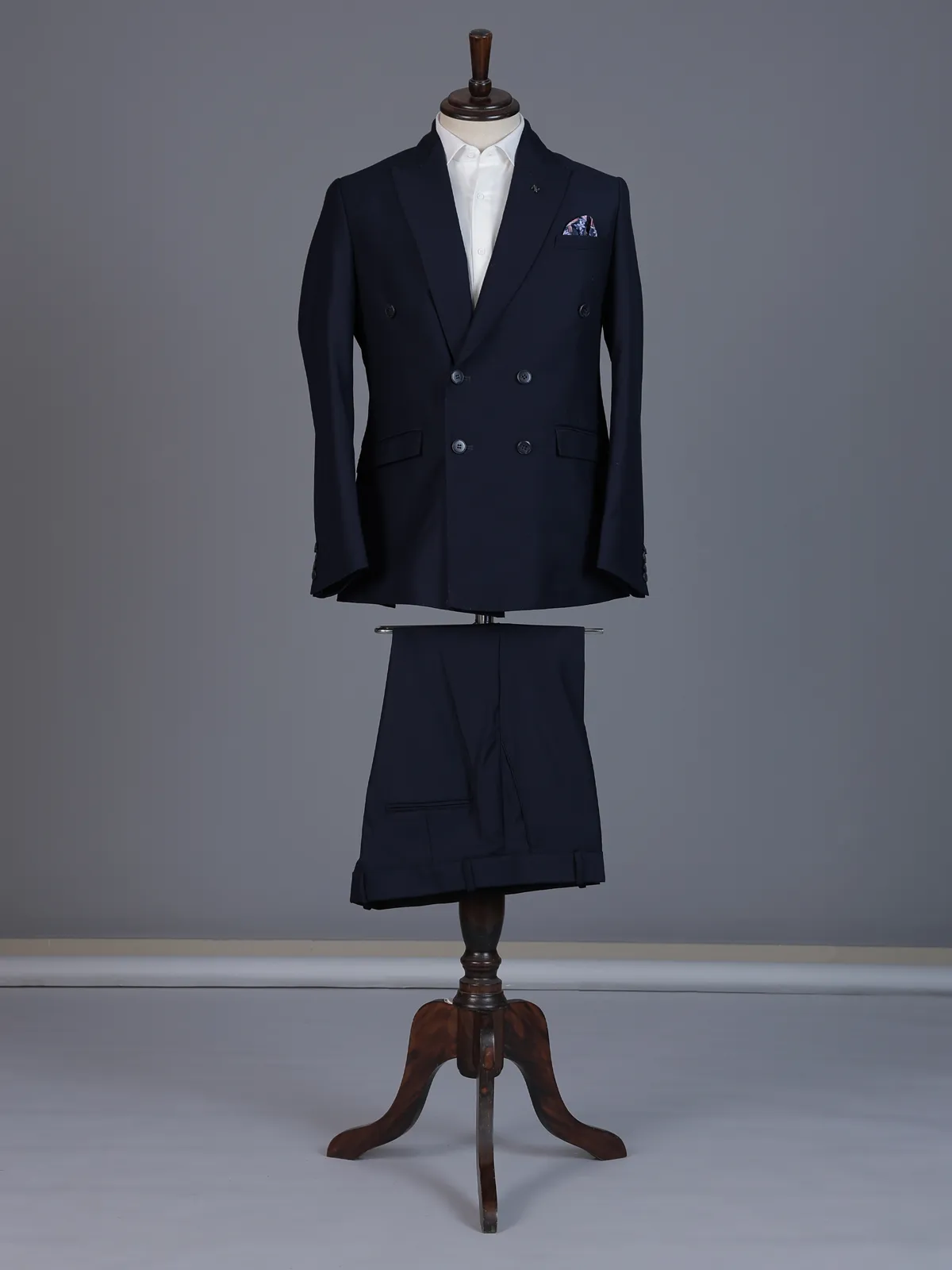 Elegant navy blue formal double breasted suit with peak lapel