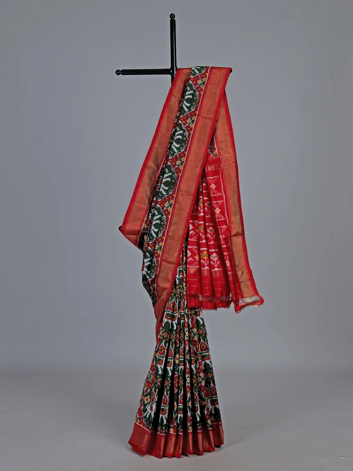 Forest green hyderabadi patola silk saree with ikat artistry