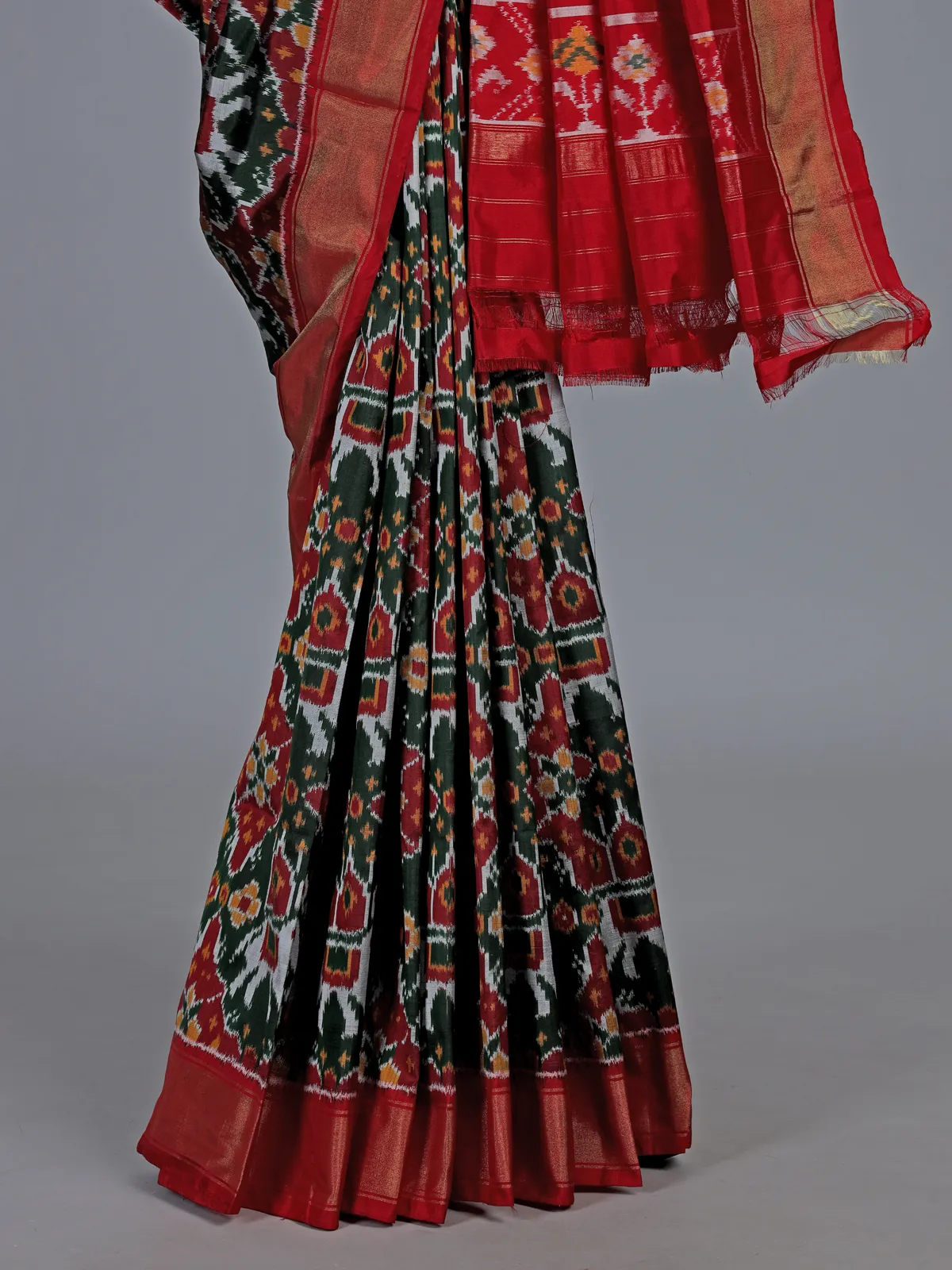 Forest green hyderabadi patola silk saree with ikat artistry