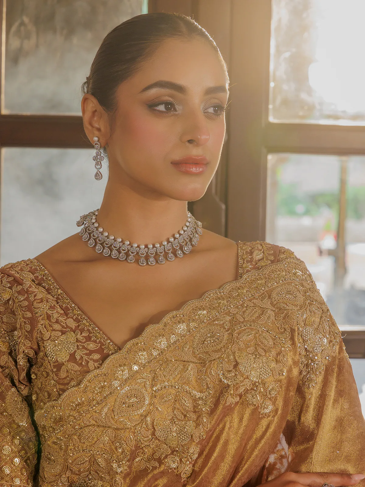 Gold silk saree with rich embellishment
