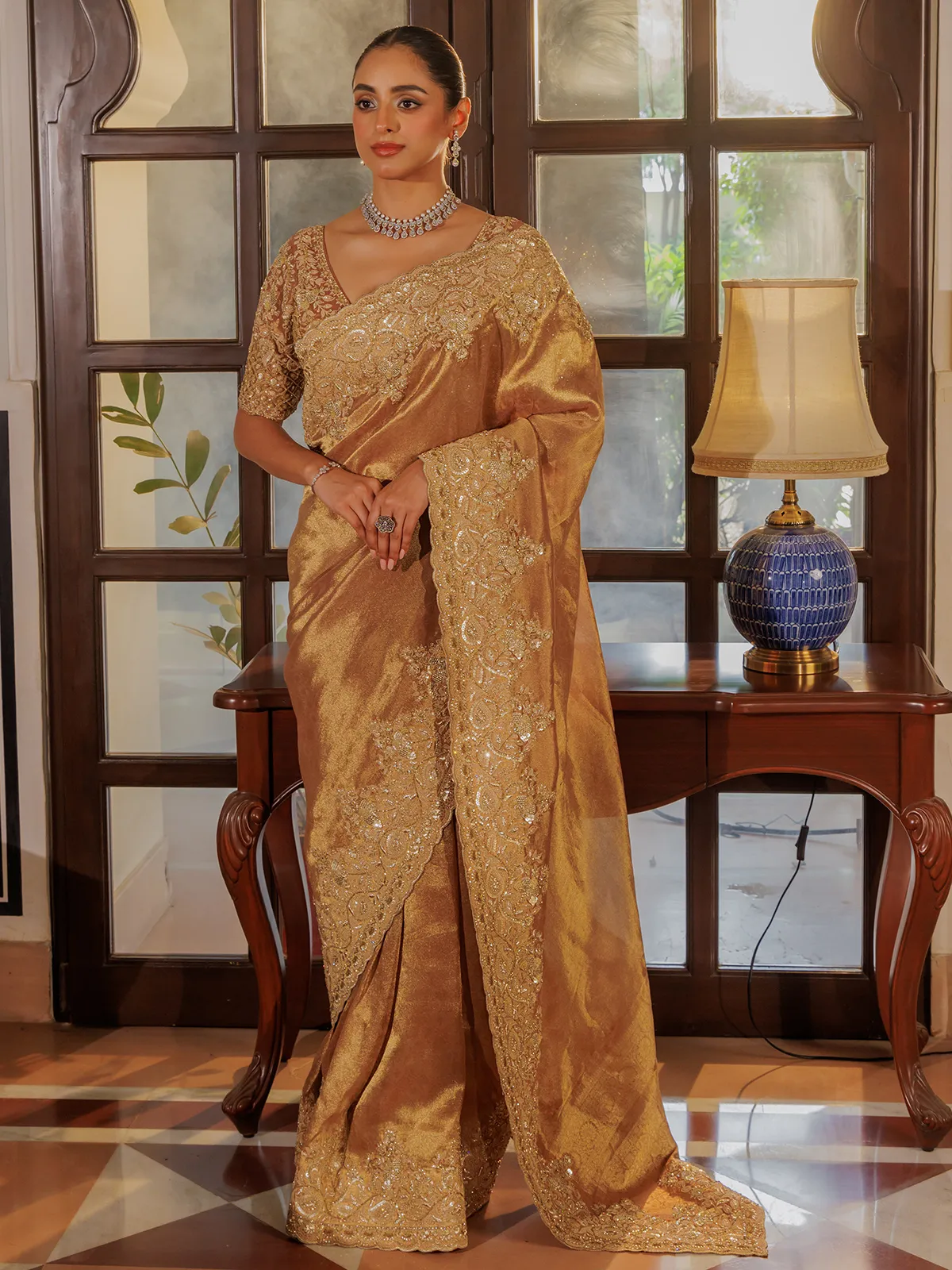 Gold silk saree with rich embellishment