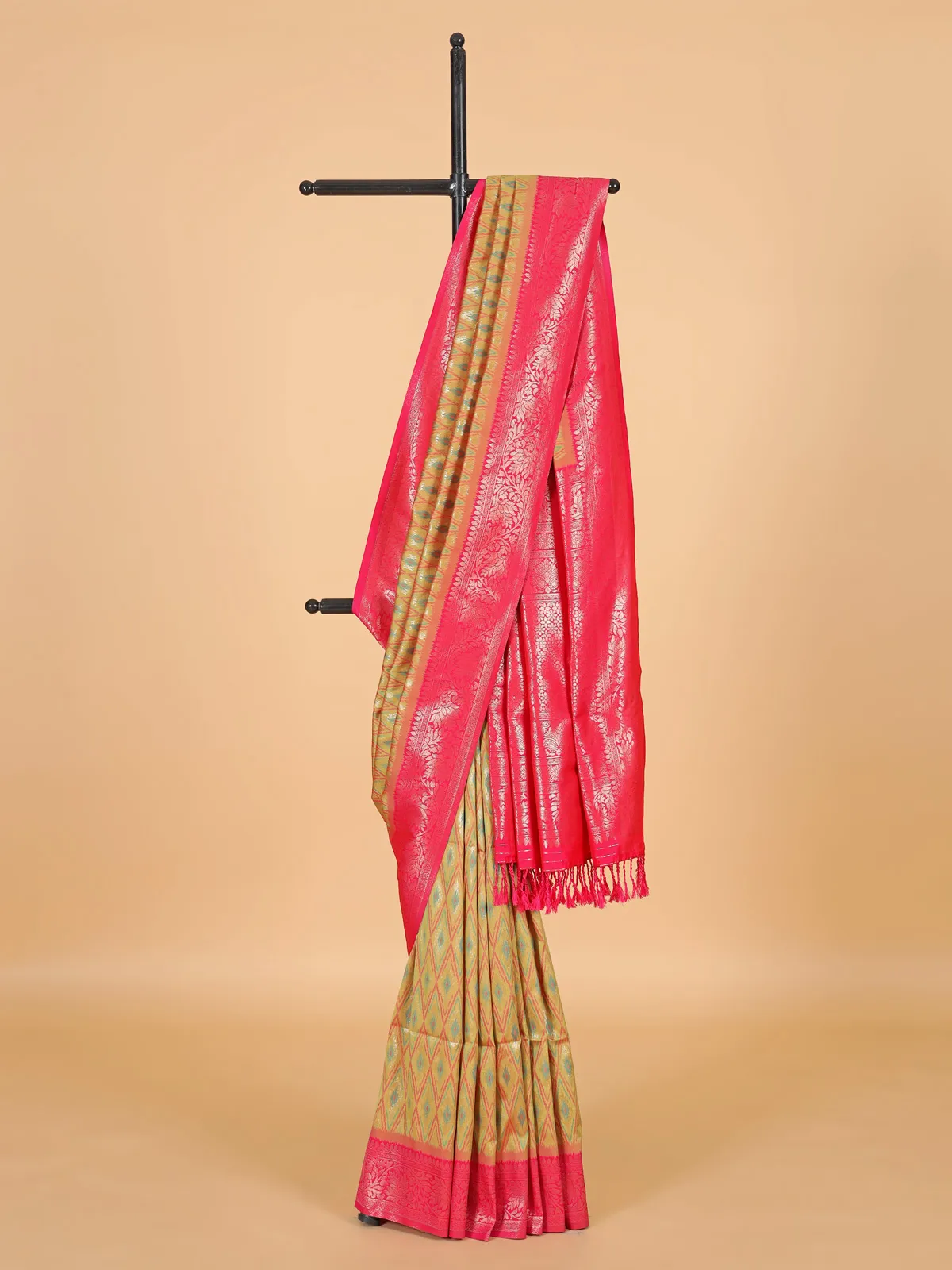 Golden silk saree with attractive pink pallu