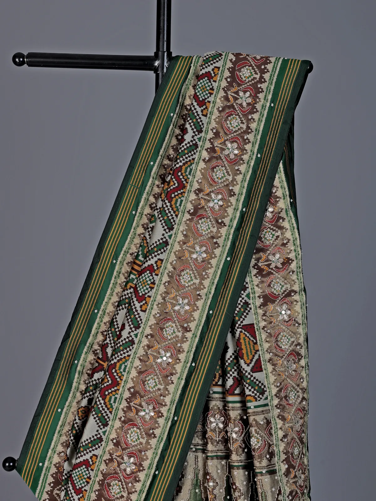 Green and off white art patola silk saree with motifs