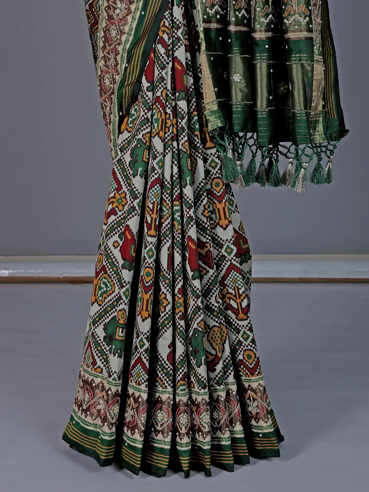 Green and off white art patola silk saree with motifs